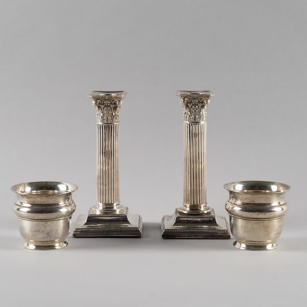 A PAIR OF SILVER CANDLESTICKS AND A PAIR OF SILVER VASES (4)