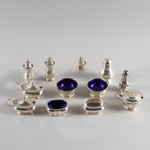 A GROUP OF SILVER CONDIMENTS (11)