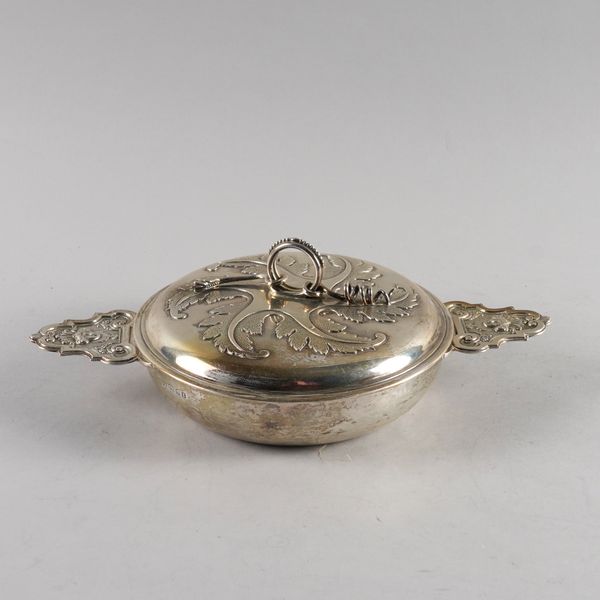 A SILVER TWIN HANDLED DISH AND COVER