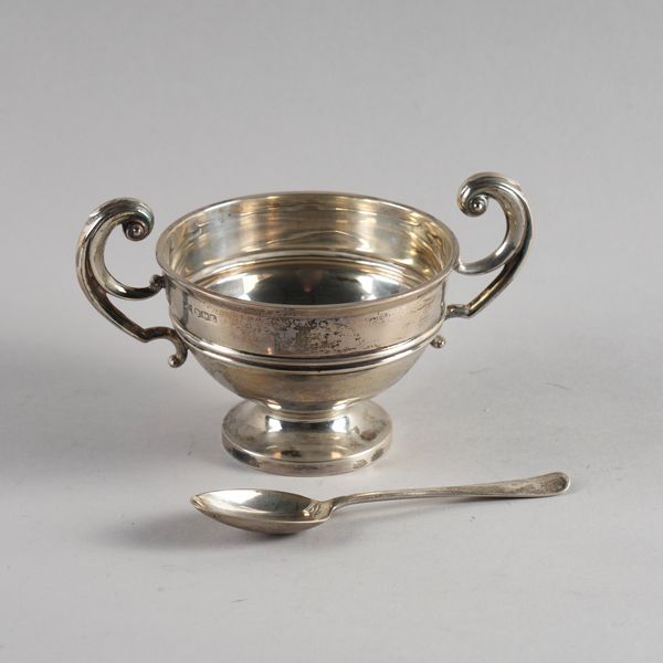 A SILVER TWIN HANDLE CHRISTENING BOWL AND A SILVER SPOON (2)