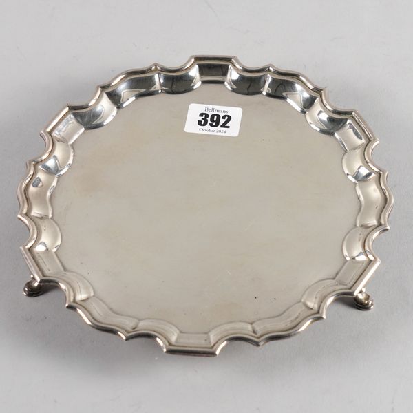 A SILVER SHAPED CIRCULAR SALVER