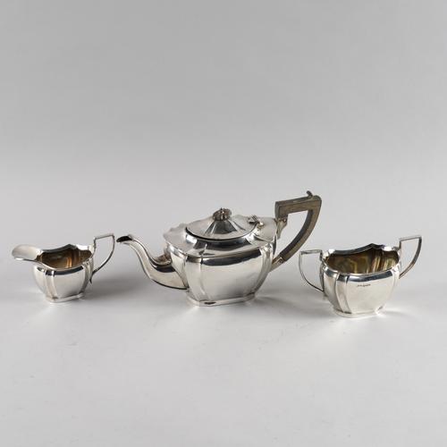 A SILVER THREE PIECE TEA SET