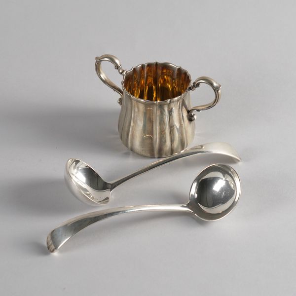 A PAIR OF SILVER SAUCE LADLES AND A SILVER TWIN HANDLED SUGAR BOWL (3)