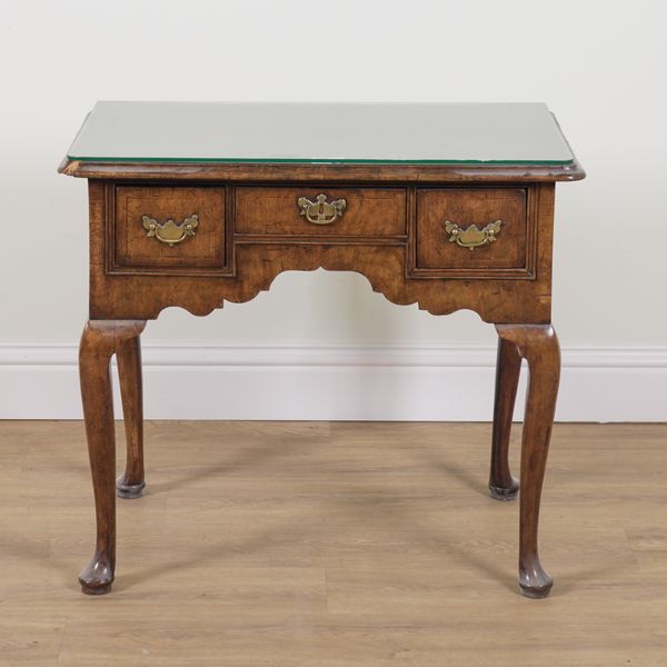 A MID-18TH CENTURY FIGURED WALNUT LOWBOY