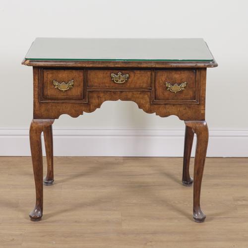 A MID-18TH CENTURY FIGURED WALNUT LOWBOY