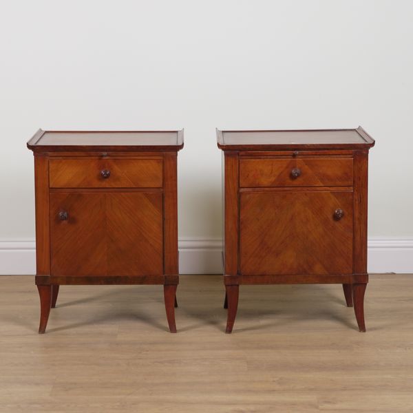 A PAIR OF MID-20TH CENTURY WALNUT BEDSIDE CUPBOARDS (2)