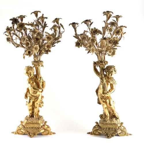 A PAIR OF FRENCH LOUIS XVI STYLE ORMOLU FIGURAL EIGHT LIGHT CANDELABRA (2)