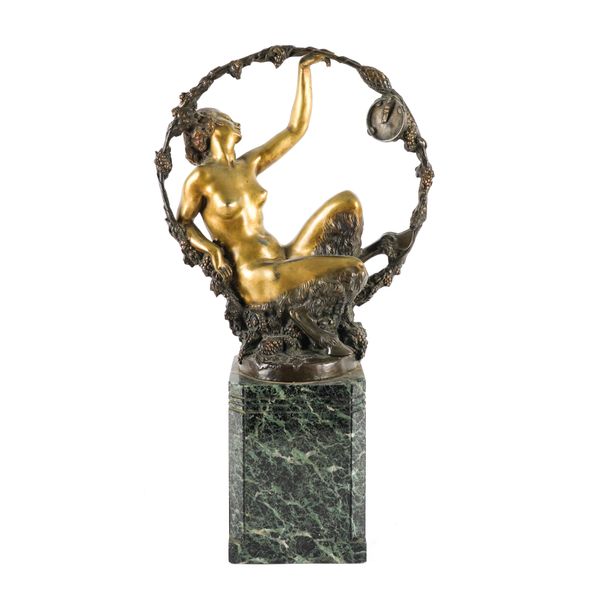 AN ART DECO GILT AND PATINATED BRONZE OF A BACCHIC NYMPH