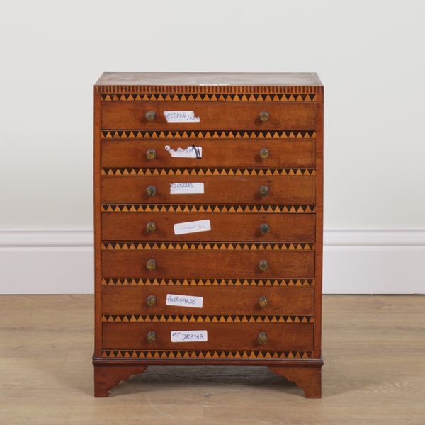 A 19TH CENTURY DOGTOOTH PARQUETRY INLAID MAHOGANY TABLE TOP SEVEN DRAWER CHEST