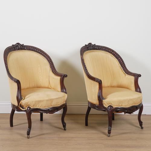 A PAIR OF 19TH CENTURY CONTINENTAL CARVED ROSEWOOD FRAMED TUB BACK ARMCHAIRS (2)