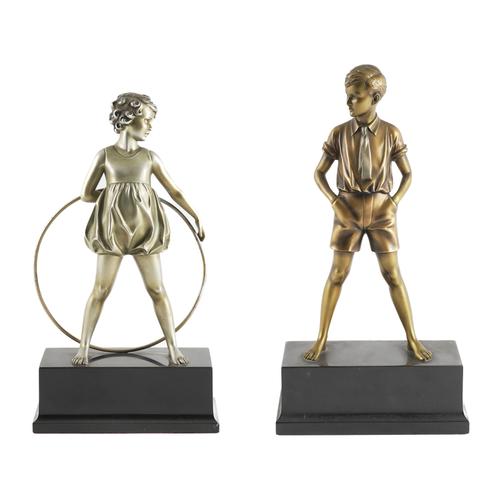 FERDINAND PREISS (GERMANY, 1882-1943): A NEAR PAIR OF ART DECO SILVERED AND GILT BRONZE FIGURES OF CHILDREN, 'THE HOOP GIRL'  AND 'SONNY BOY'  (2)