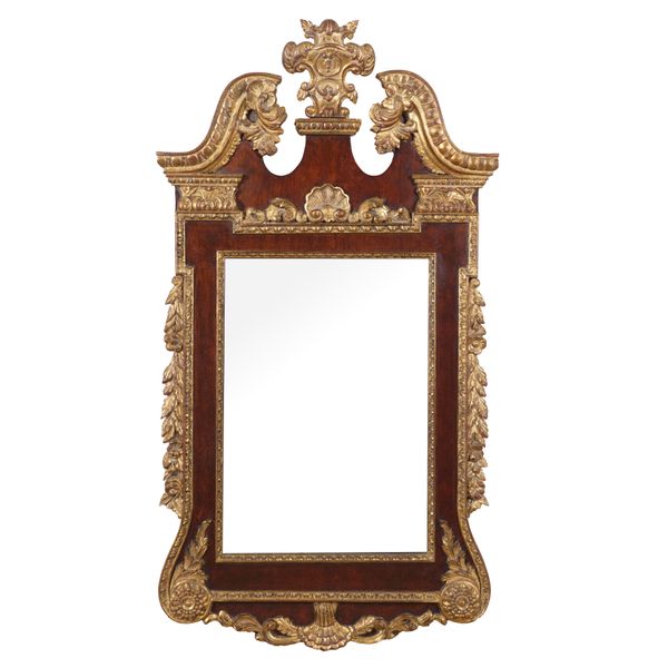 A GEORGE II STYLE PARCEL GILT WALNUT WALL MIRROR