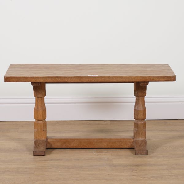 ROBERT MOUSEMAN THOMPSON OF KILBURN; AN OAK RECTANGULAR ADZED TOPPED COFFEE TABLE