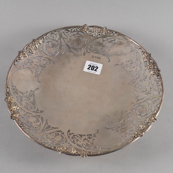 A SILVER SHAPED CIRCULAR DISH