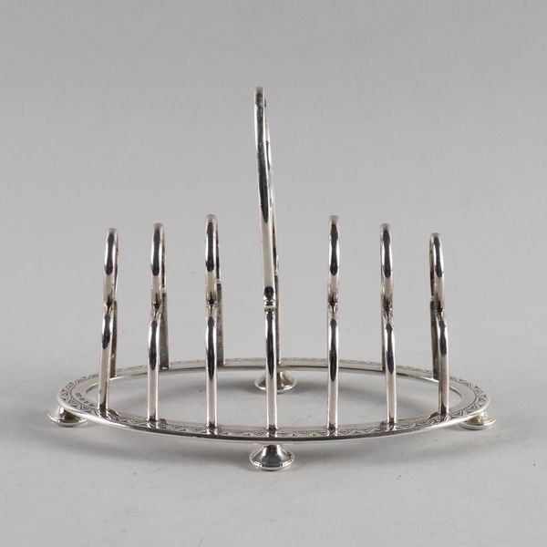 A VICTORIAN SILVER SEVEN BAR TOASTRACK