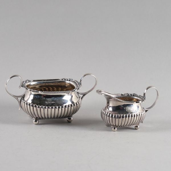 A SILVER SUGAR BOWL WITH MATCHING MILK JUG (2)