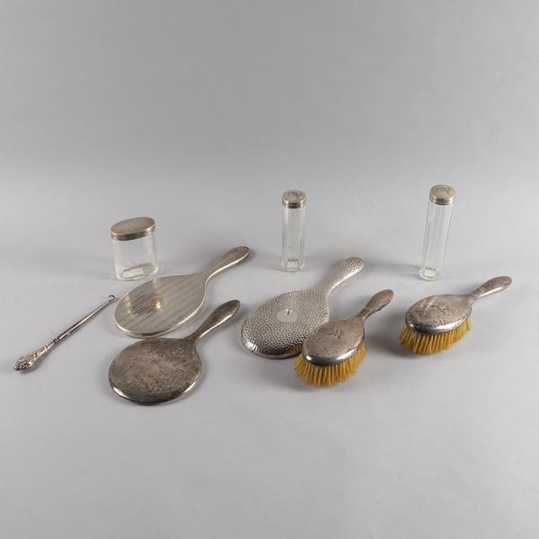 A GROUP OF SILVER MOUNTED DRESSING TABLE AND TOILET WARES (9)