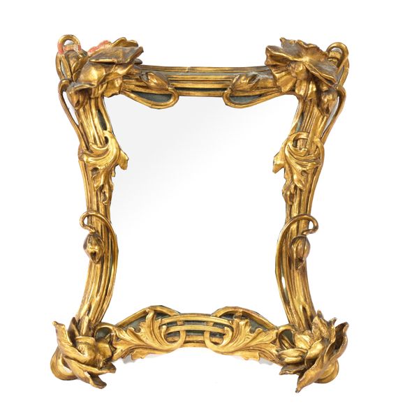 AN ART NOUVEAU FOLIATE CARVED GILT FRAMED WALL MIRROR