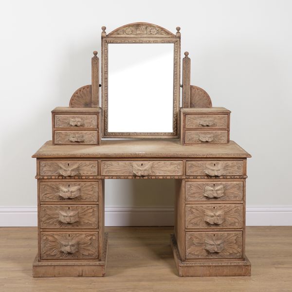 A VICTORIAN CARVED BLEACHED OAK PEDESTAL DRESSING TABLE