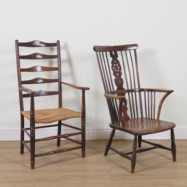 AN EARLY 19TH CENTURY RUSH SEATED FRUITWOOD LADDER BACK OPEN ARMCHAIR (2)