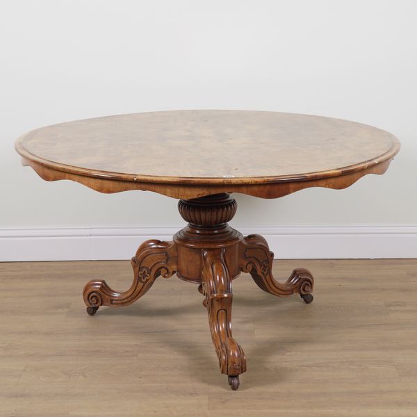 A VICTORIAN FIGURED WALNUT CIRCULAR SNAP TOP CENTRE TABLE