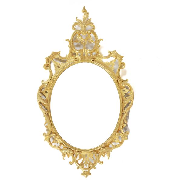 A GEORGE III STYLE GILT FRAMED OVAL WALL MIRROR