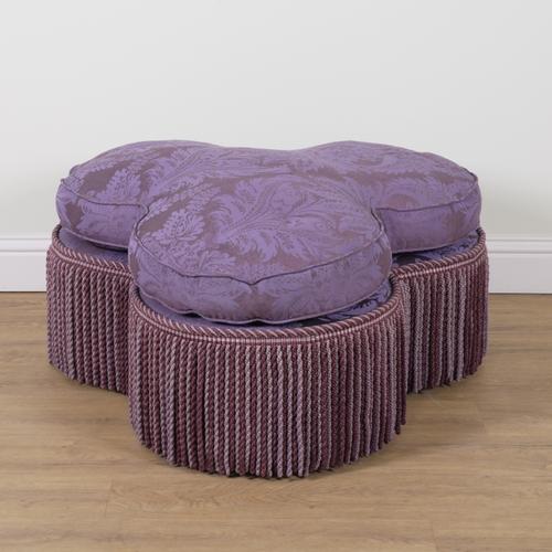 GEORGE SMITH; A PATTERNED PURPLE UPHOLTERESD TREFOIL CENTRE STOOL