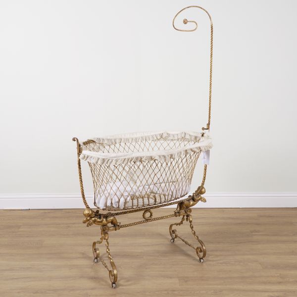 AN EARLY 20TH CENTURY GOLD PAINTED WROUGHT IRON CHILD'S COT