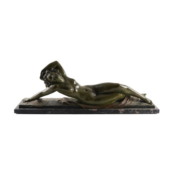 MARCEL BOURAINE (1886-1948): AN ART DECO PATINATED BRONZE RECLINING GIRL