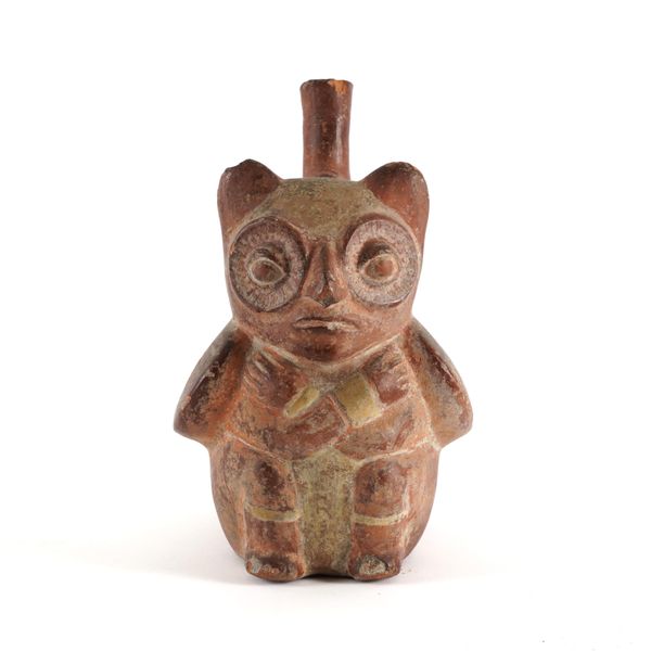 A PRE-COLUMBIAN PERUVIAN RED POTTERY OWL FORMED STIRRUP FLASK VESSEL