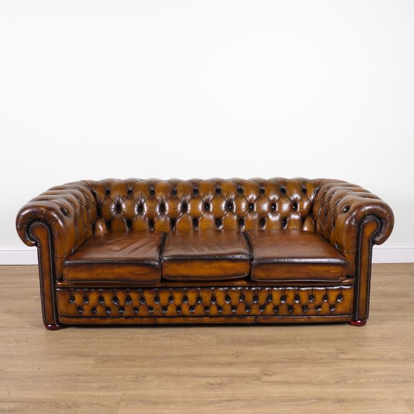 A MODERN BROWN LEATHER BUTTON UPHOLSTERED CHESTERFIELD SOFA