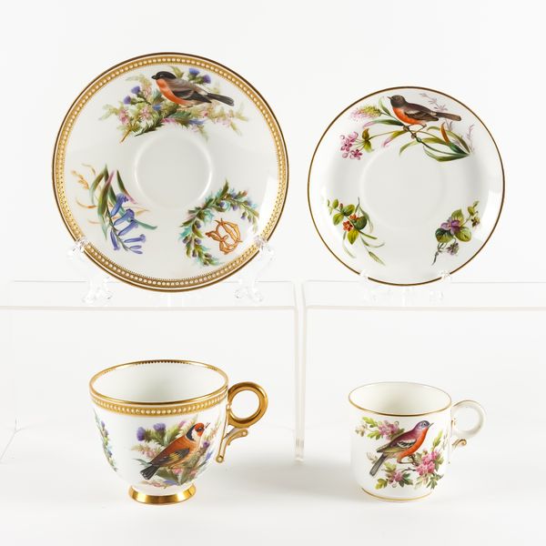 A LARGE ROYAL WORCESTER CUP AND SAUCER (4)