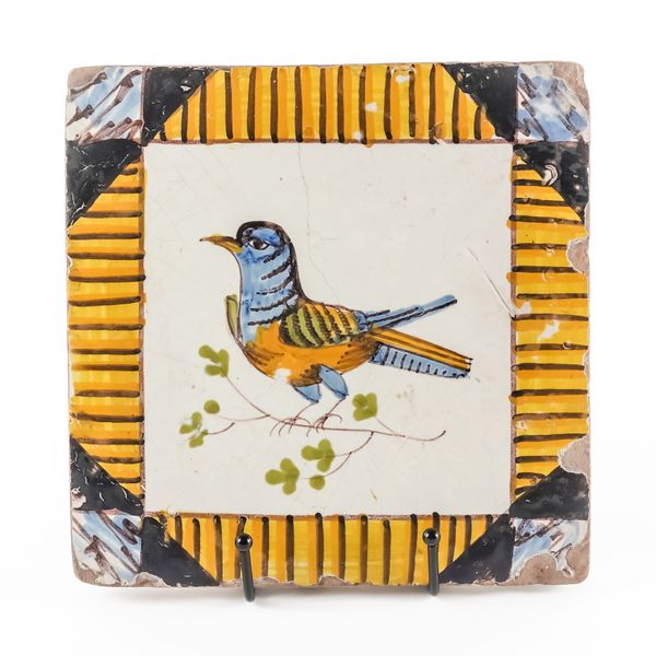 A CONTINENTAL MAIOLICA SQUARE TILE