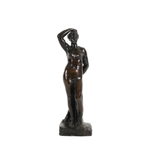 A PATINATED BRONZE FIGURE OF VENUS OR A BATHER