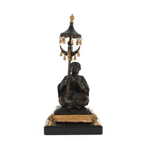 A FRENCH PARCEL-GILT AND PATINATED BRONZE MODEL OF A SEATED CHINESE OPIUM SELLER