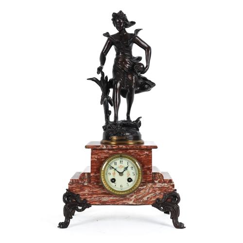A FRENCH BRONZE PATINATED SPELTER MOUNTED PINK MARBLE FIGURAL MANTEL CLOCK