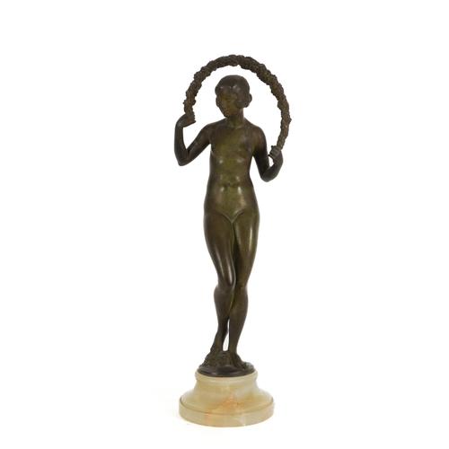 JOE DESCOMPS CORMIER; A PATINATED BRONZE FEMALE FIGURE WITH A FLORAL BOWER