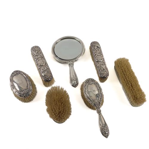 A STERLING SILVER MOUNTED FIVE PIECE DRESSING SET AND A PAIR OF SILVER MOUNTED CLOTHES BRUSHES (7)