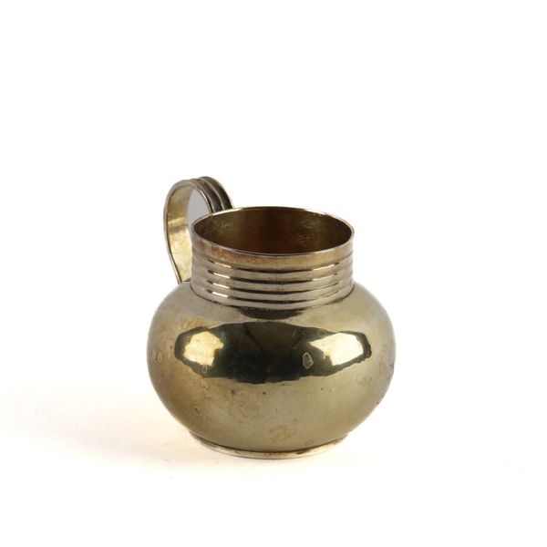 A GEORGE I SILVER GILT BRITIANNIA STANDARD MUG