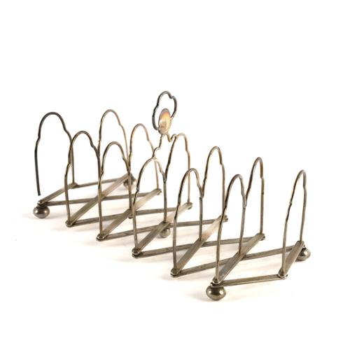A SILVER EXPANDING SIX DIVISION TOAST RACK