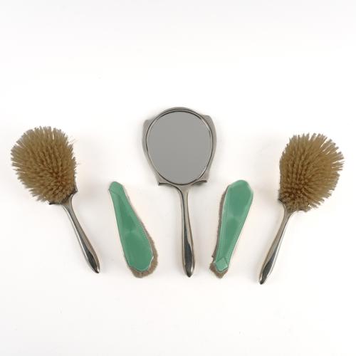 A SILVER AND PALE GREEN ENAMEL MOUNTED FIVE PIECE LADY'S DRESSING SET (5)