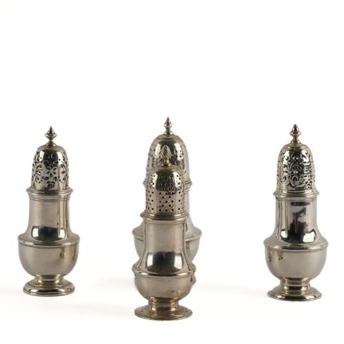 A GEORGE II SILVER CASTER AND THREE FURTHER CASTERS (4)