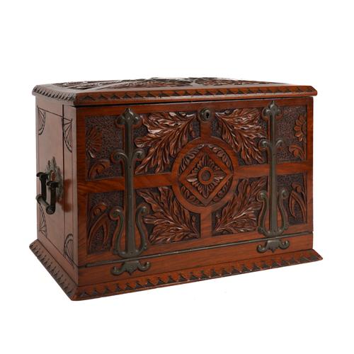 AN ARTS & CRAFTS BRASS MOUNTED CARVED WALNUT WRITING BOX