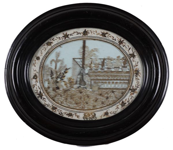 AN UNUSUAL NAPOLEON III HAIR WORK EMBROIDERED PICTURE DEPICTING A GARDENER AT WORK