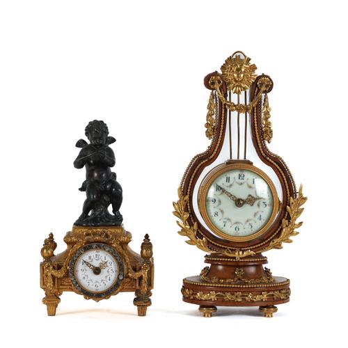 A LOUIS XVI STYLE GILT-METAL MOUNTED LYRE SHAPED TIME PIECE AND ANOTHER BRONZE MOUNTED WITH GLASS PASTE (2)