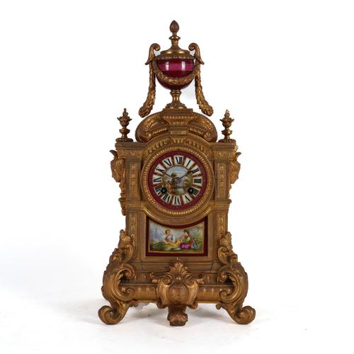 A FRENCH GILT SPELTER AND PARIS SEVERES STYLE PORCELAIN MOUNTED MANTEL CLOCK