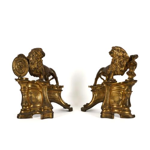 A PAIR OF GILT BRONZE LION CHENET OR FIRE DOGS (2)