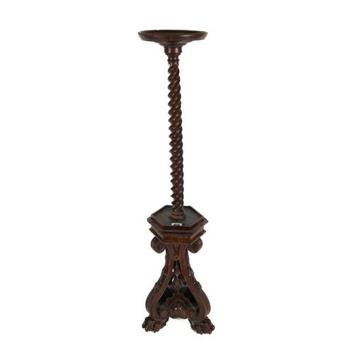 AN ITALIAN CARVED WALNUT PEDESTAL STAND