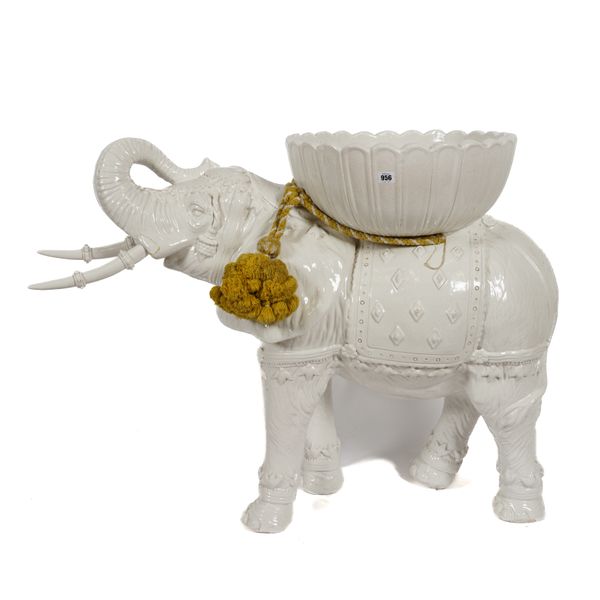 A WHITE CRACKLE GLAZED MODEL OF  FLOOR STANDING ELEPHANT POSSIBLY A JARDINIERE
