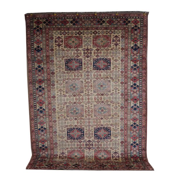 AN AFGHAN CARPET OF CAUCASIAN DESIGN